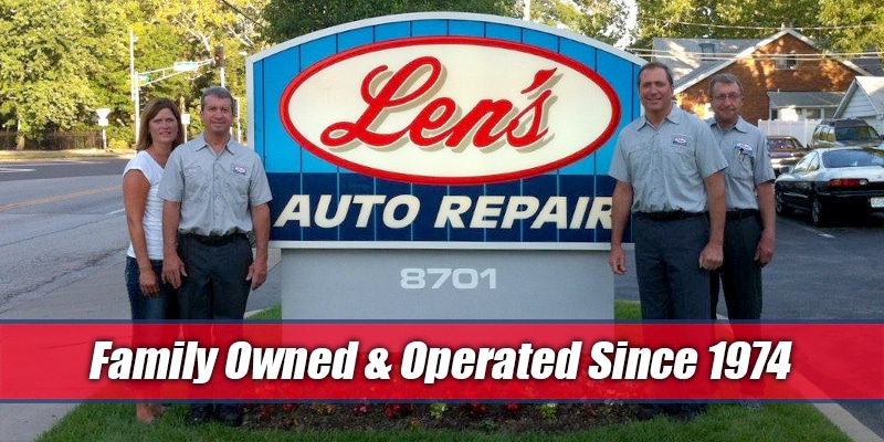 Marit Greg Kim Jon standing outside the sign at Len's Auto Repair Overland.